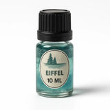 Klein glazen flesje pure geurolie eiffel 10 ml met zwarte dop en teal gekleurde vloeistof en dennenboomlabel