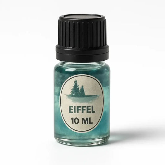 Klein glazen flesje pure geurolie eiffel 10 ml met zwarte dop en teal gekleurde vloeistof en dennenboomlabel
