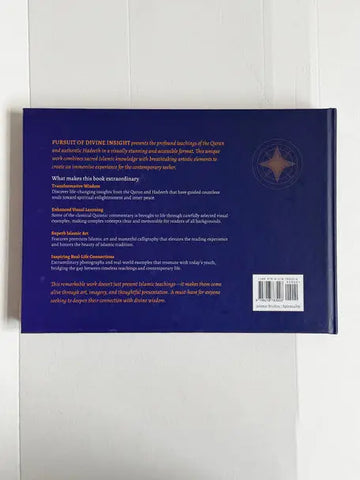Deep blue hardcover book pursuit of divine insight with gold foil text and compass rose emblem on the back cover