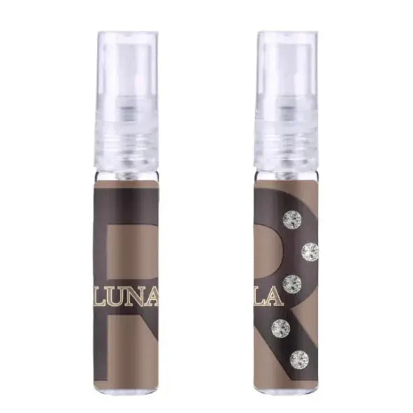 Twee transparante sprayflessen r stella en luna edp 50 ml met bruine en zwarte labels en zilveren strasstenen met merknaam luna in goud