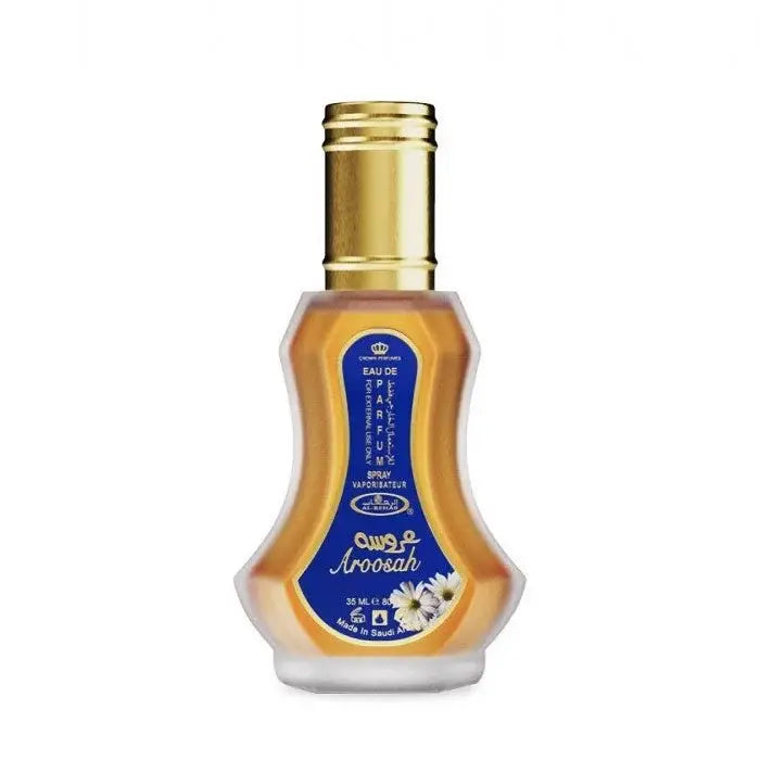 Al-rehab parfum aroosah een gouden transparante glazen fles met gouden dop en blauw etiket met witte bloemen