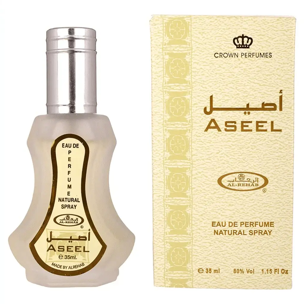 Al-rehab parfum aseel eau de parfum natural spray in een helder glazen fles met zilveren dop en gouden label in een crème doos met arabische tekst