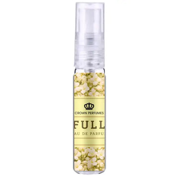 Een heldere glazen sprayfles met transparante dop en een lichtgele label met witte bloemen en crown perfumes branding al-rehab parfum full