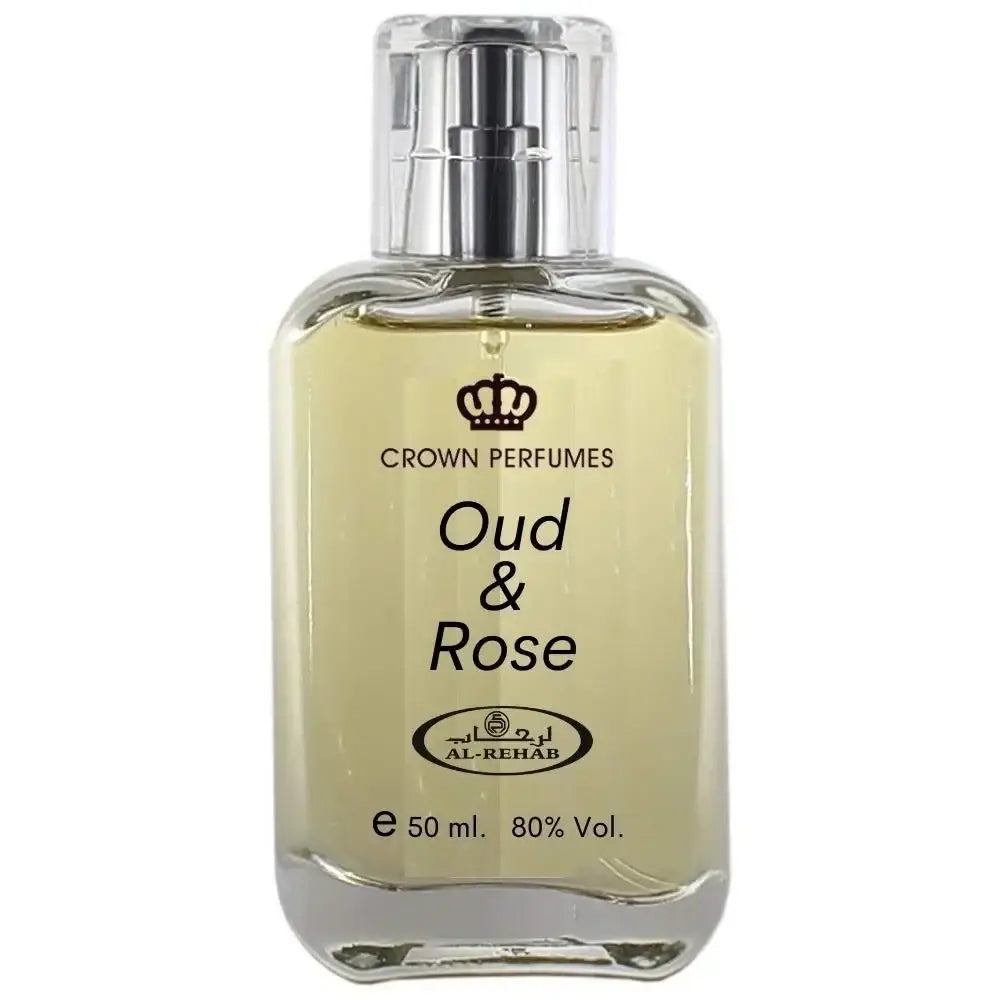 Een heldere glazen fles al-rehab parfum oud en rose met zilveren spray en lichtgele vloeistof