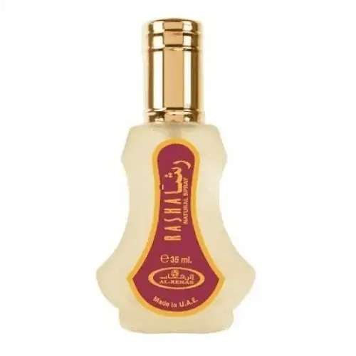 Een slank helder glazen flesje van al-rehab parfum rasha met gouden dop en wijnrode arabische label