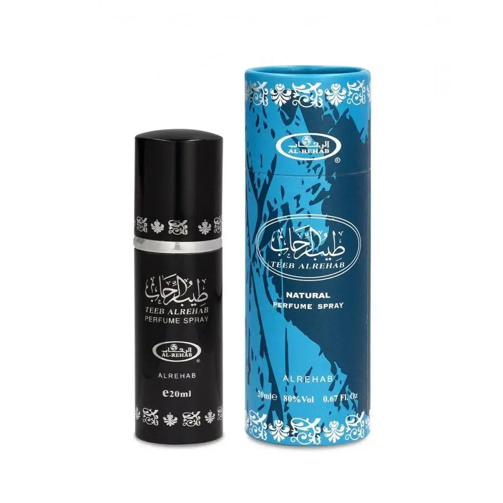 Zwart cilindrische parfum sprayfles met zilveren band en witte arabische tekst naast blauw patroon kartonnen verpakking van al-rehab parfum teeb al rehab