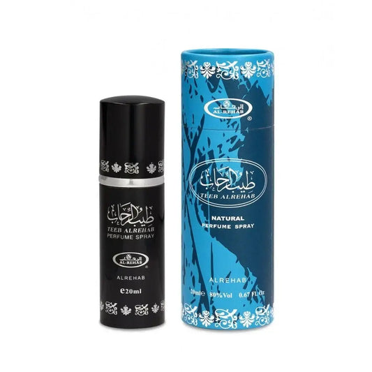 Zwart cilindrische parfum sprayfles met zilveren band en witte arabische tekst naast blauw patroon kartonnen verpakking van al-rehab parfum teeb al rehab