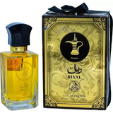 Goudengele riyal edp parfumfles met zwarte dop en gouden accenten naast een gouden doos met arabische kalligrafie en koffiepotlogo