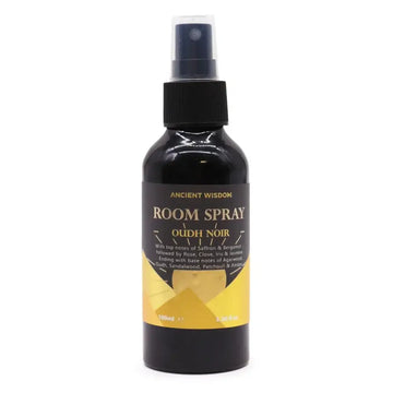 Zwarte glazen fles met zwarte sprayspray en gouden etiket van ancient wisdom met oudh noir roomspray