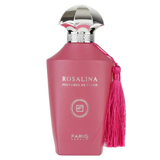 Een levendige roze parfumfles rosálina fariis met een zilveren, gefacetteerde dop en bijpassende kwast