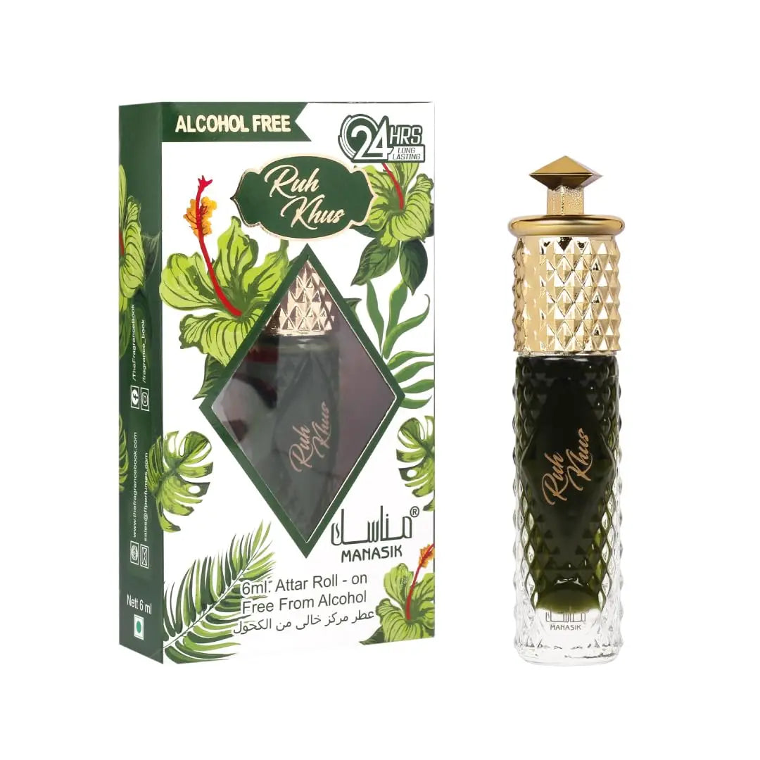 Een slanke donker groene glazen parfumfles ruh khus parfumolie met een gouden facet dop en reliëfmerkering