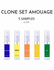 Vijf kleine transparante sprayflessen met kleurrijke labels in blauw geel oranje en groen parfumsample set amouage clone