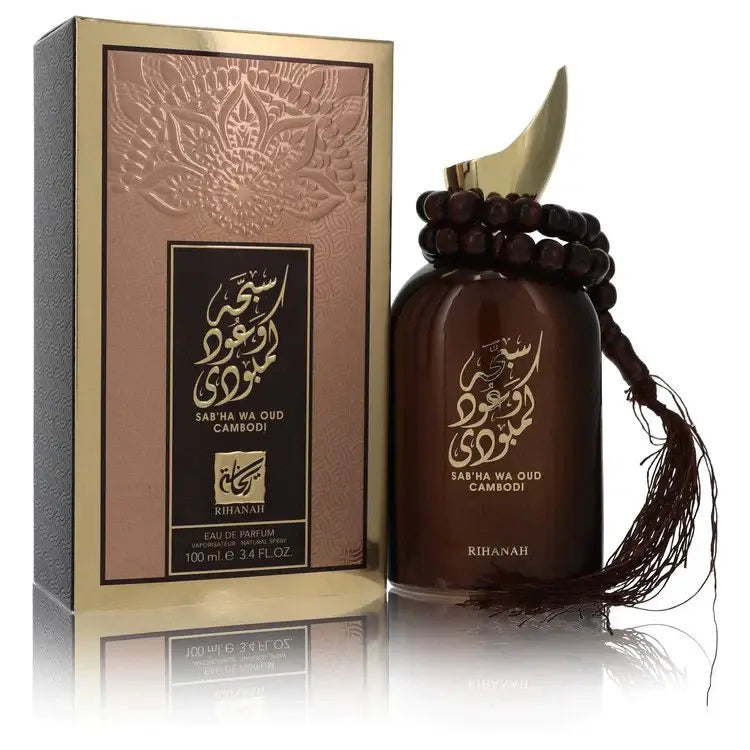 Donkere bruine glazen fles sab ha wa oud cambodi parfumspray van rihanah met goudkleurig arabisch schrift en decoratieve halve maan dop