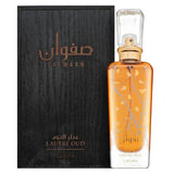 Een gouden rechthoekige glazen parfumfles safwaan l’autre oud met matte gouden dop en geëtst boomtakontwerp