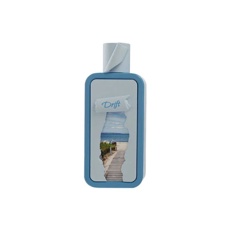 Seasons Drift EDP 100 ml: blauwe parfumfles met strand en oceaan collage