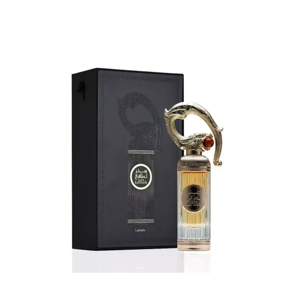 Elegante goudkleurige parfumfles sehr met draakvormige dop en amberkleurige edelsteen met gouden geur