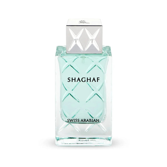 Een slanke transparante glazen fles met licht turquoise vloeistof en reliëf diamantpatroon shaghaf for men