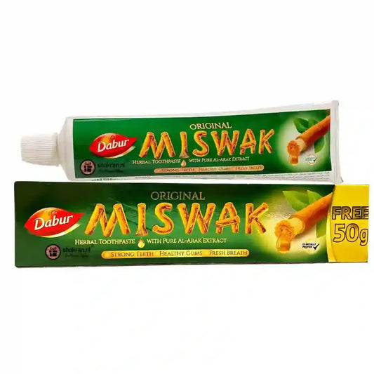 Groene en witte tube dabur original miswak kruidige tandpasta met gele promotiebanner in tandpasta met siwaak product