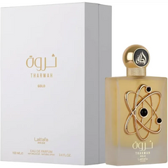 Tharwah Gold parfumfles met gouden atoomontwerp, witte doos en Arabische tekst