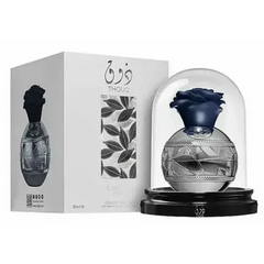 Lattafa Pride Thouq blauwe roosparfum 80ml fles met glazen koepel en zwarte standaard