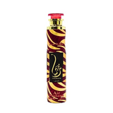 Een strakke 300 ml luchtverfrisser fles met een maroon en gouden zebraprint en een elegant zwart label met arabische tekst en merknaam thuraya